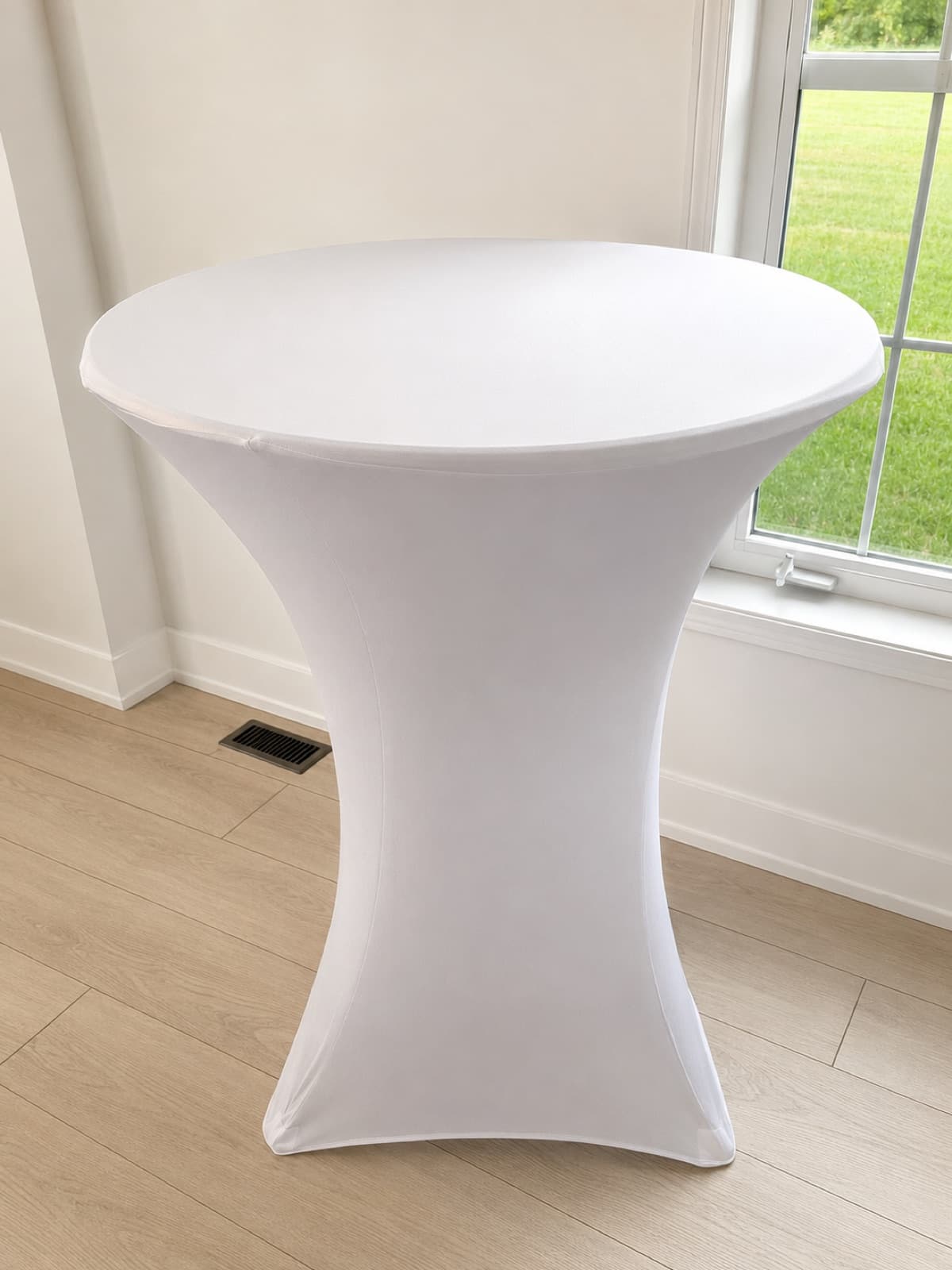 Cocktail table with white spandex cover fitted